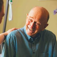 een lachende patient